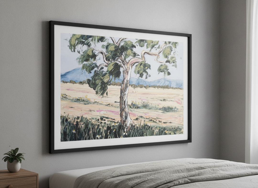 Minimalist artwork displayed in a calm, light-filled bedroom interior