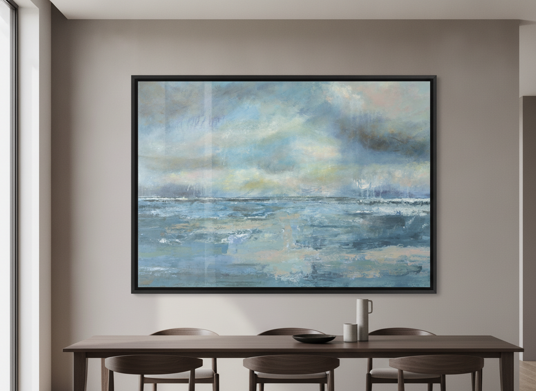 Wall art styled above a dining table in a contemporary home