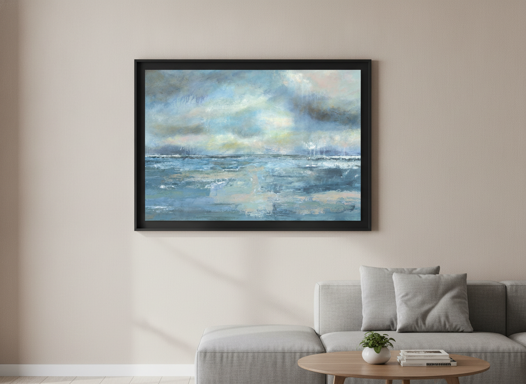Modern wall art styled above a sofa in a neutral living room