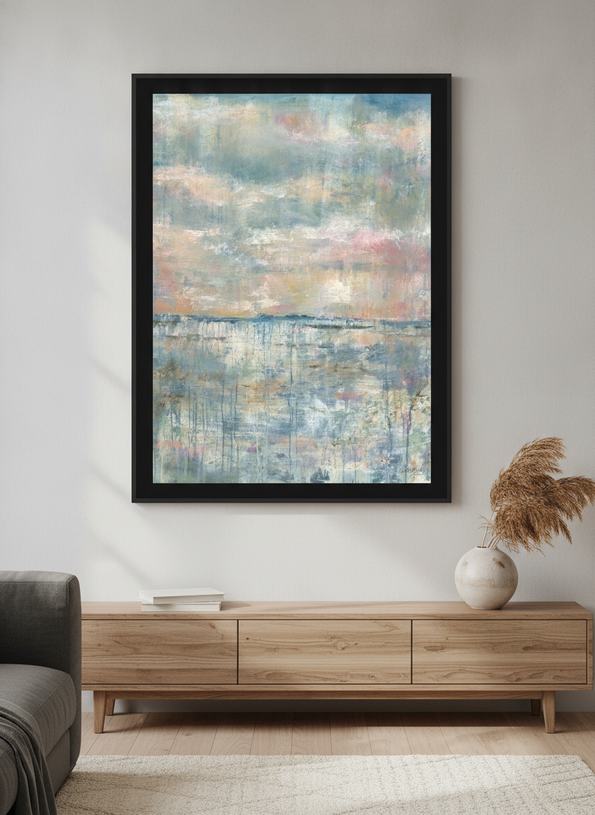 Modern wall art styled above a sofa in a neutral living room