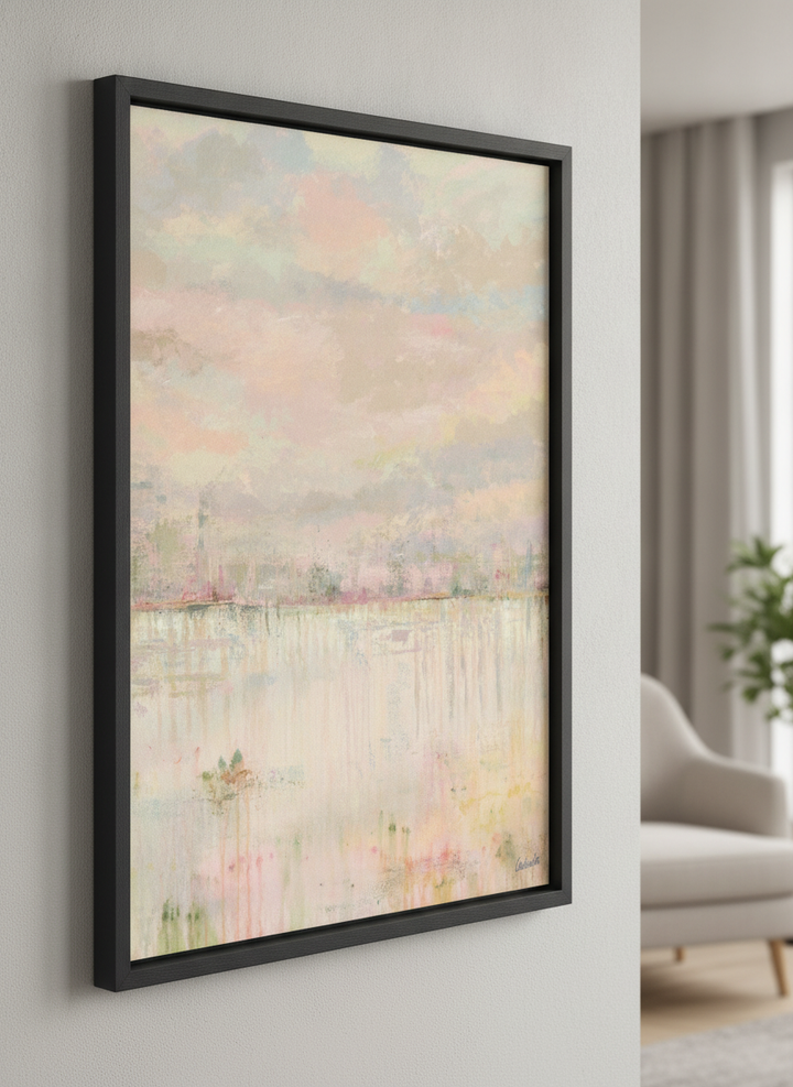 Modern wall art styled above a sofa in a neutral living room