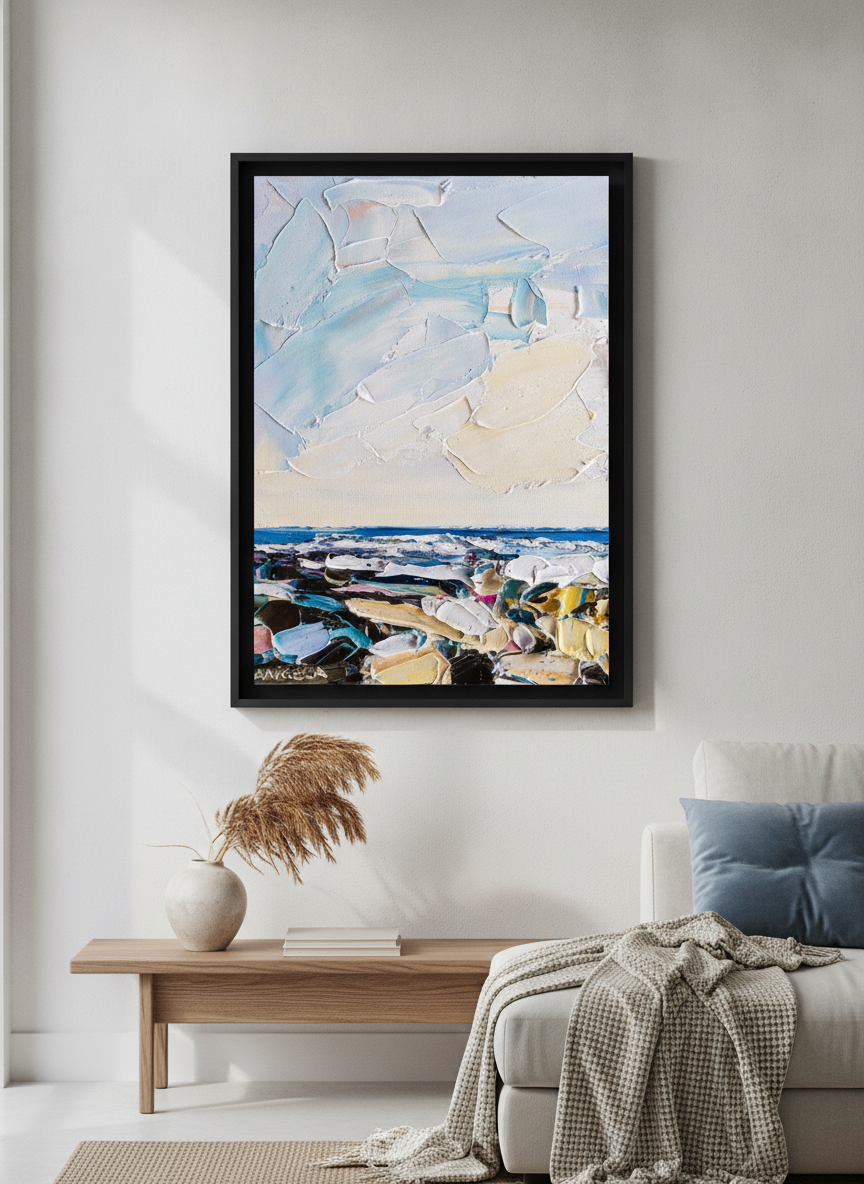 Modern wall art styled above a sofa in a neutral living room