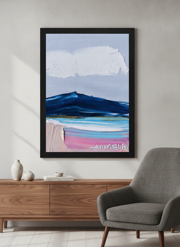 Modern wall art styled above a sofa in a neutral living room