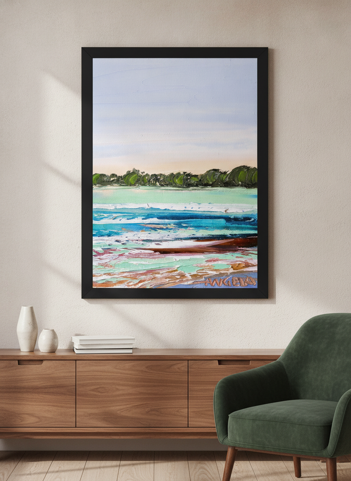 Modern wall art styled above a sofa in a neutral living room