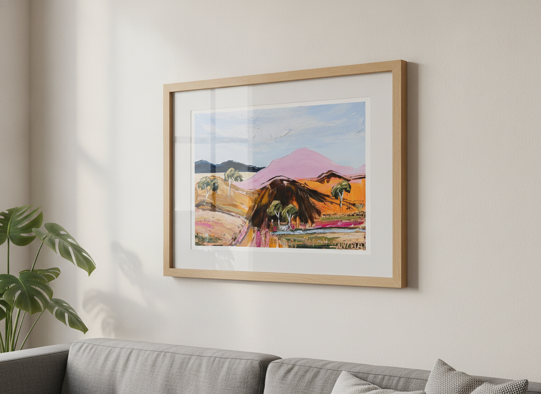 Modern wall art styled above a sofa in a neutral living room