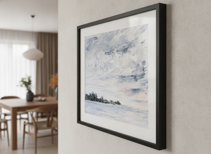 Wall art styled above a dining table in a contemporary home