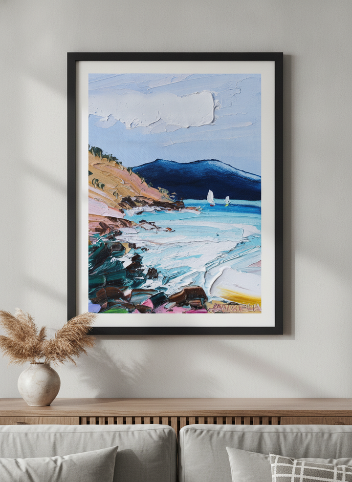 Modern wall art styled above a sofa in a neutral living room
