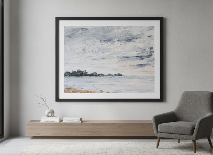 Modern wall art styled above a sofa in a neutral living room