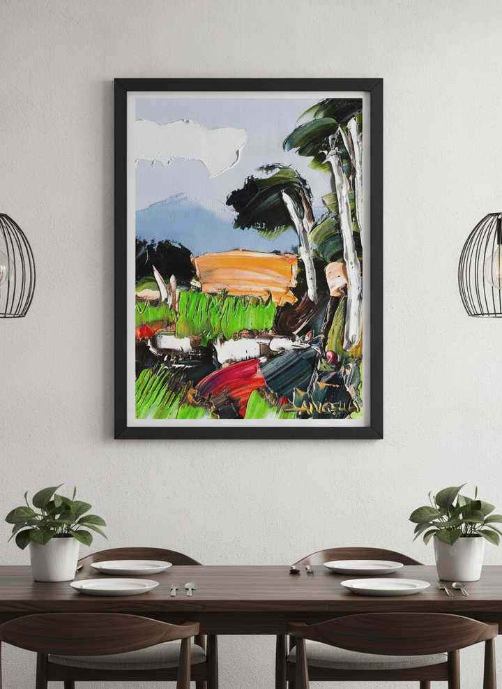 Wall art styled above a dining table in a contemporary home