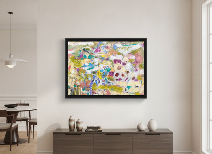 Wall art styled above a dining table in a contemporary home