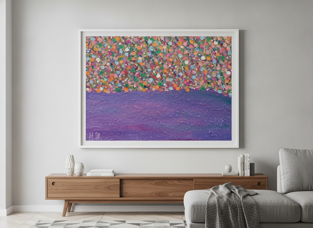 Modern wall art styled above a sofa in a neutral living room