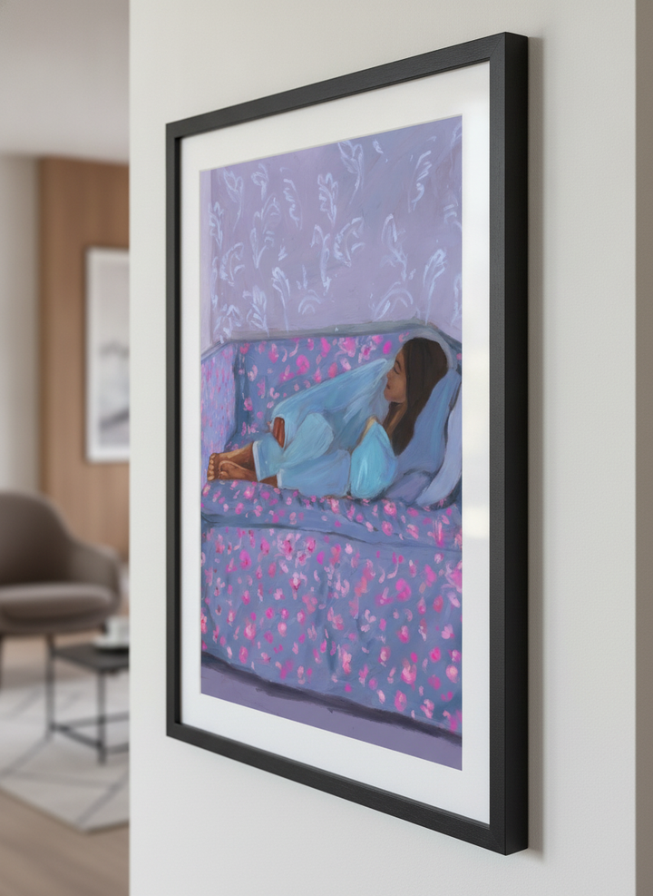 Modern wall art styled above a sofa in a neutral living room