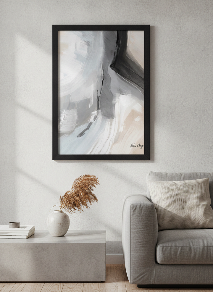 Modern wall art styled above a sofa in a neutral living room