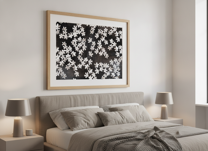 Minimalist artwork displayed in a calm, light-filled bedroom interior