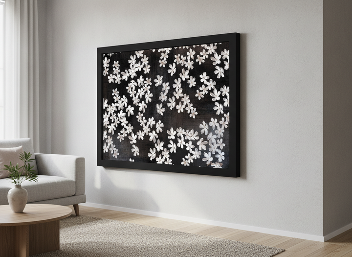 Modern wall art styled above a sofa in a neutral living room