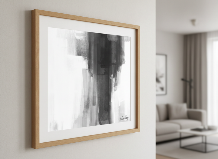 Modern wall art styled above a sofa in a neutral living room