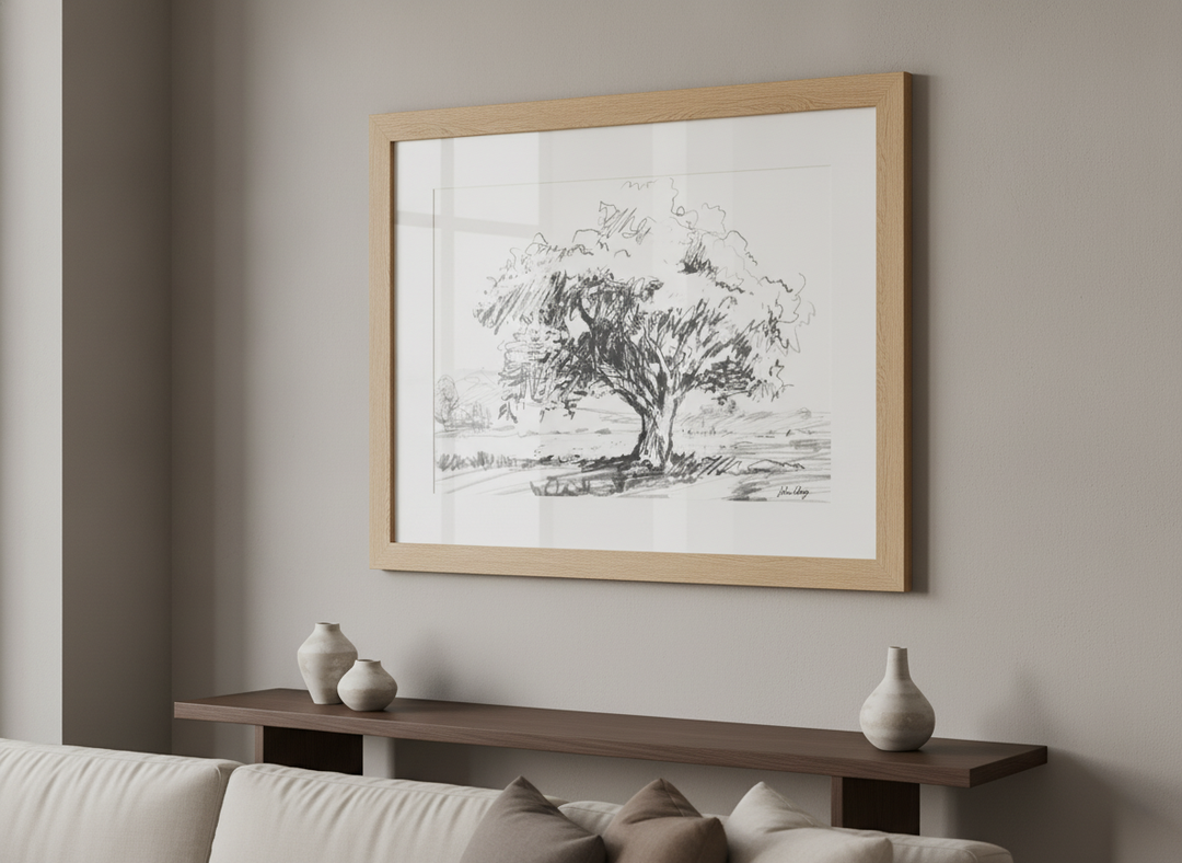 Modern wall art styled above a sofa in a neutral living room