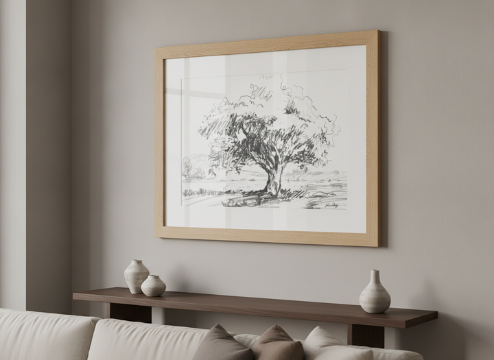 Modern wall art styled above a sofa in a neutral living room