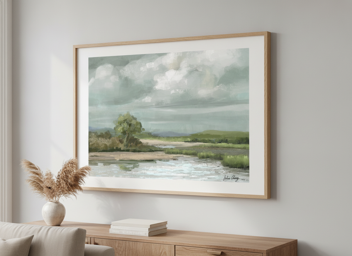 Modern wall art styled above a sofa in a neutral living room