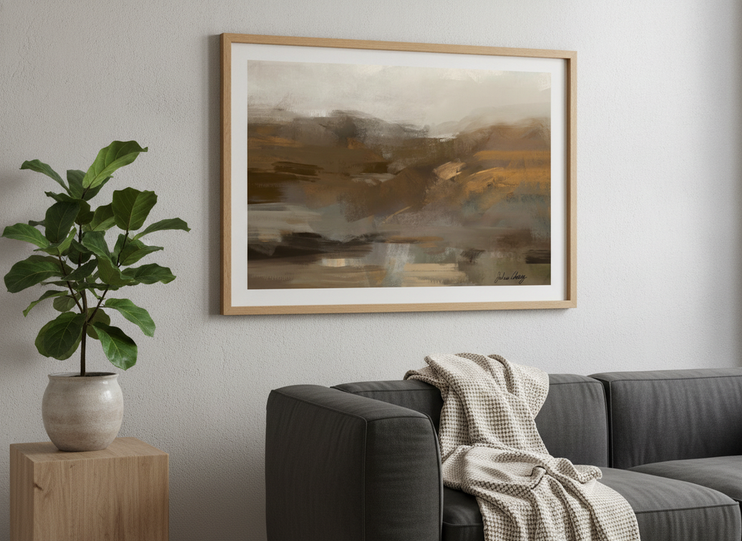 Modern wall art styled above a sofa in a neutral living room