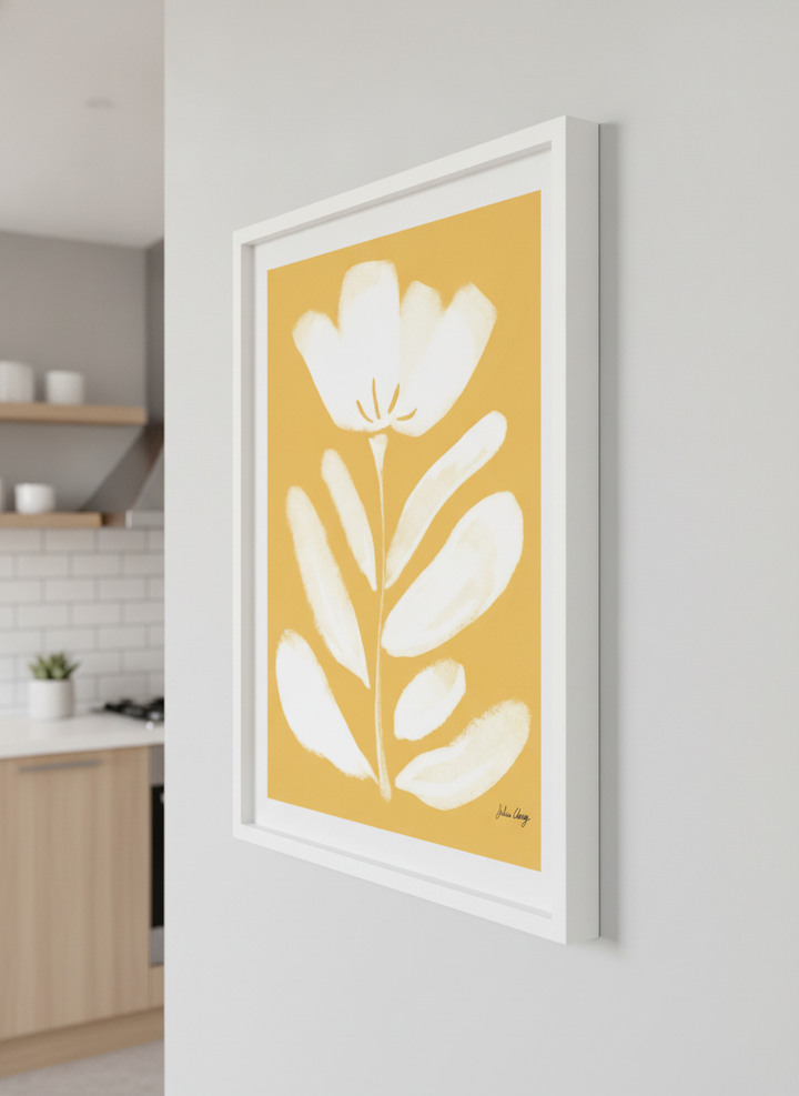Artwork styled on the wall of a bright modern kitchen
