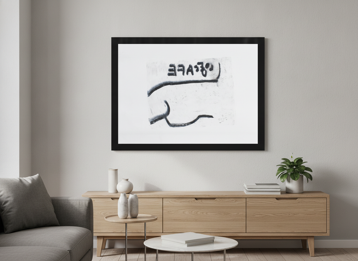 Modern wall art styled above a sofa in a neutral living room