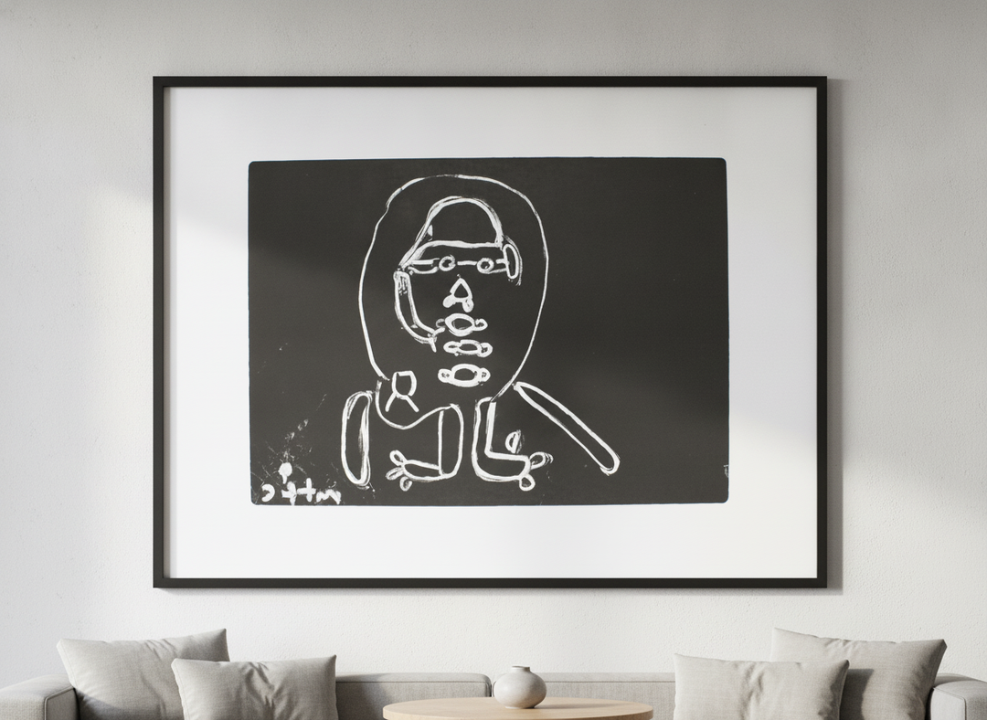 Modern wall art styled above a sofa in a neutral living room