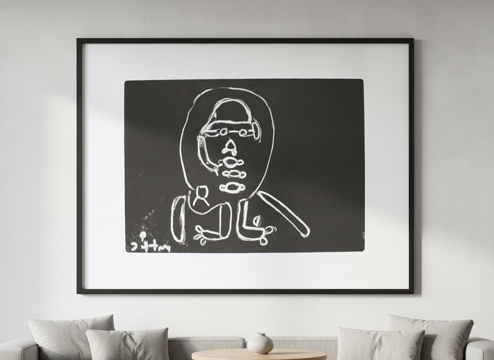 Modern wall art styled above a sofa in a neutral living room