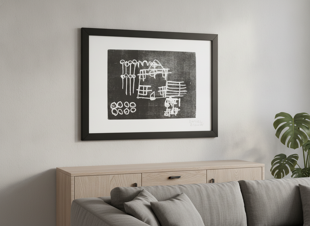 Modern wall art styled above a sofa in a neutral living room