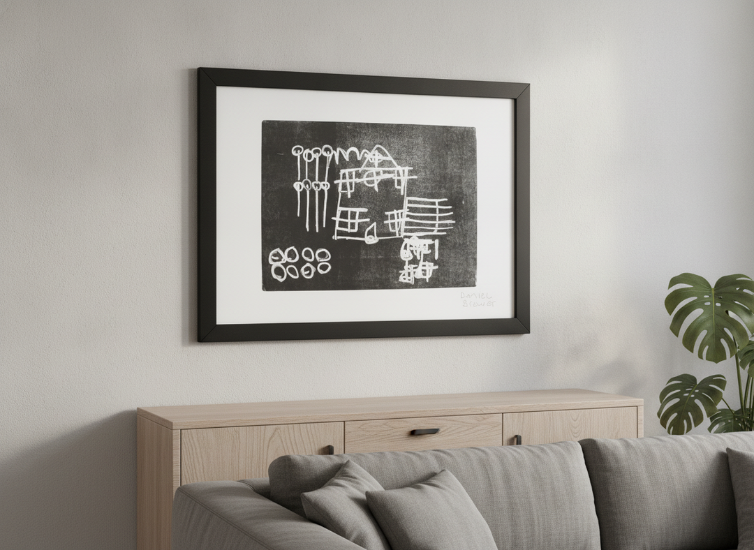 Modern wall art styled above a sofa in a neutral living room