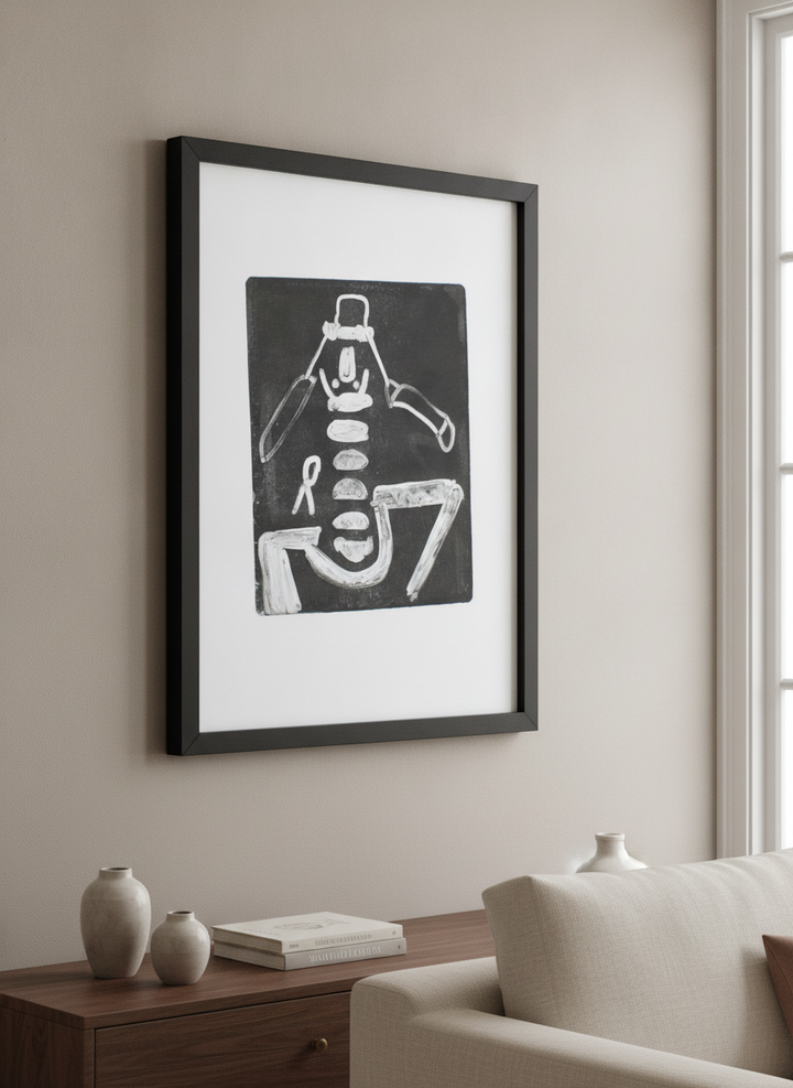 Modern wall art styled above a sofa in a neutral living room