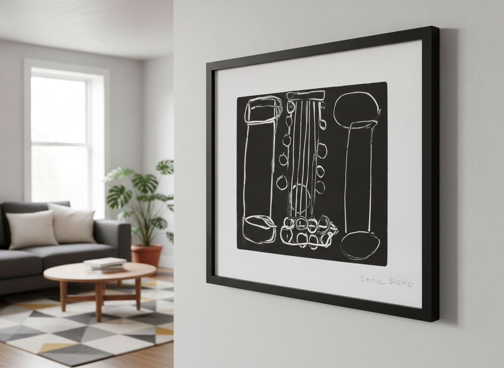 Modern wall art styled above a sofa in a neutral living room