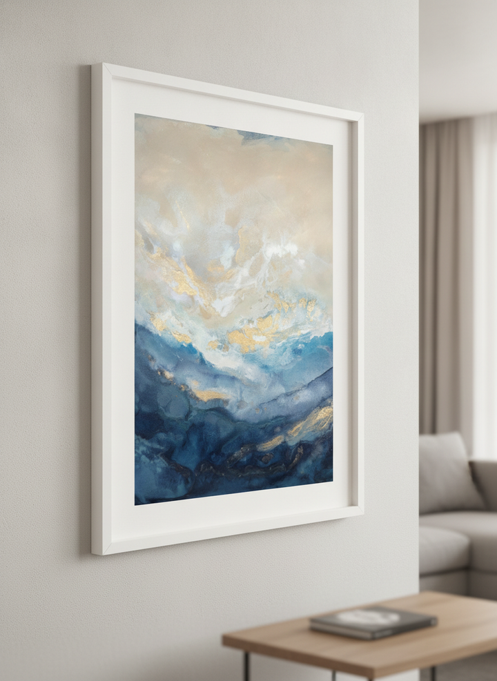 Modern wall art styled above a sofa in a neutral living room