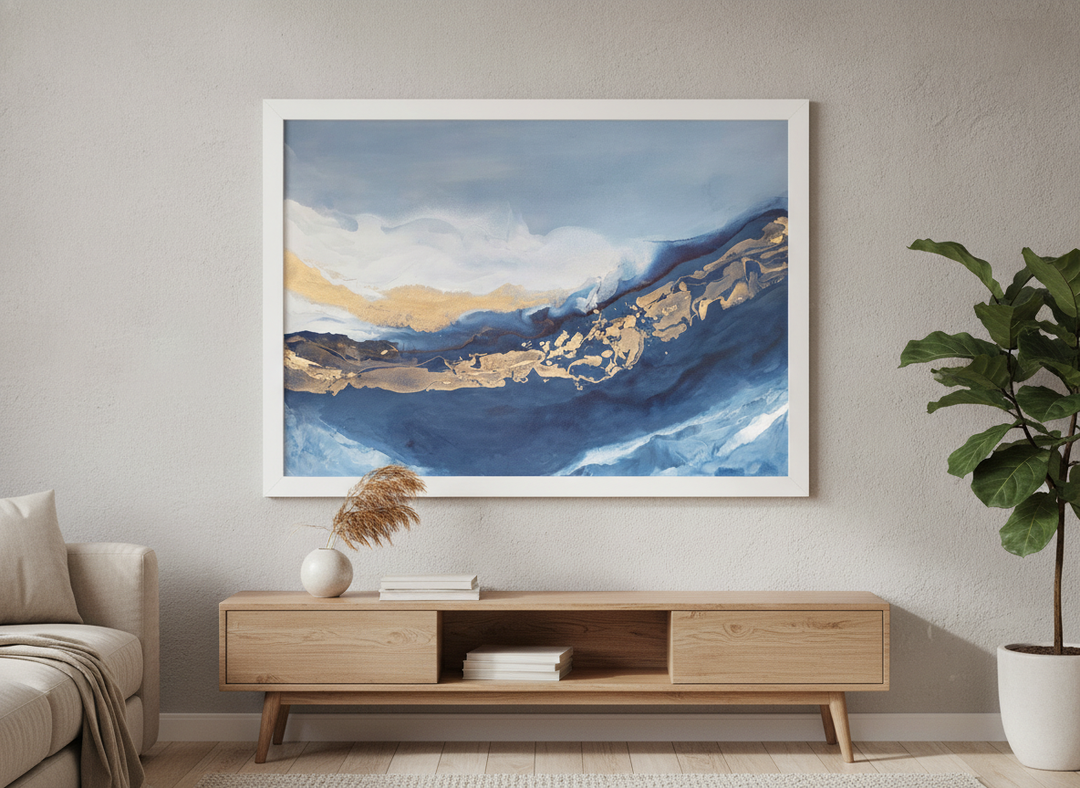 Modern wall art styled above a sofa in a neutral living room