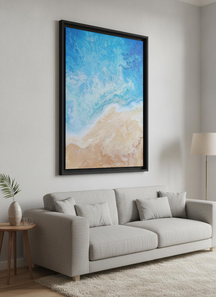 Modern wall art styled above a sofa in a neutral living room
