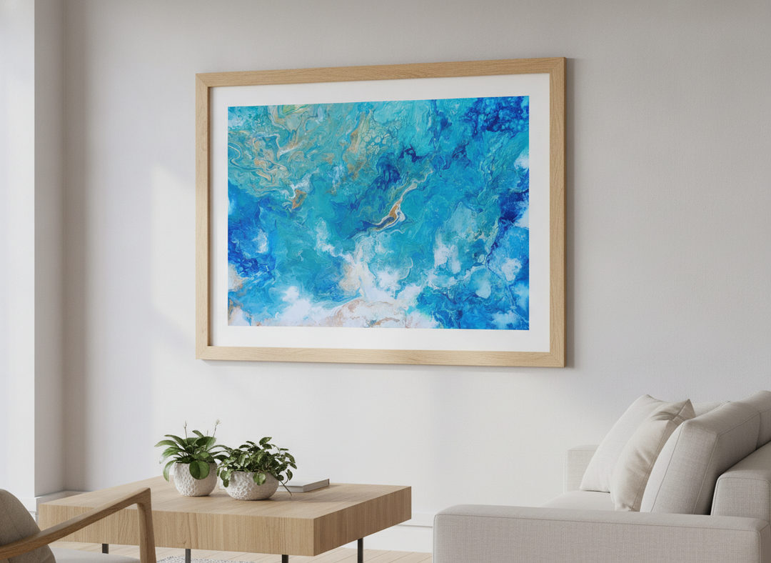 Modern wall art styled above a sofa in a neutral living room