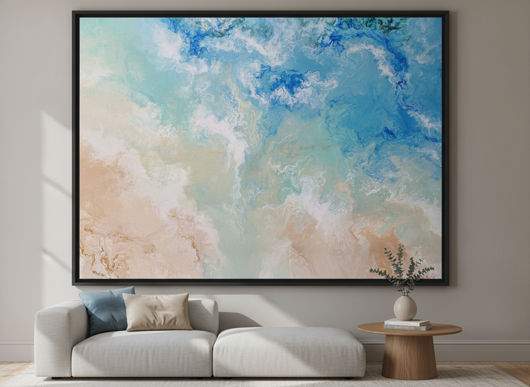 Modern wall art styled above a sofa in a neutral living room