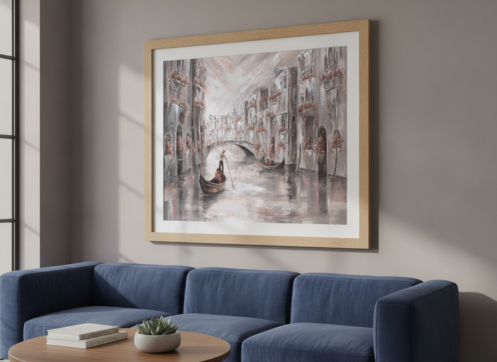 Modern wall art styled above a sofa in a neutral living room