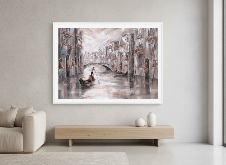 Modern wall art styled above a sofa in a neutral living room