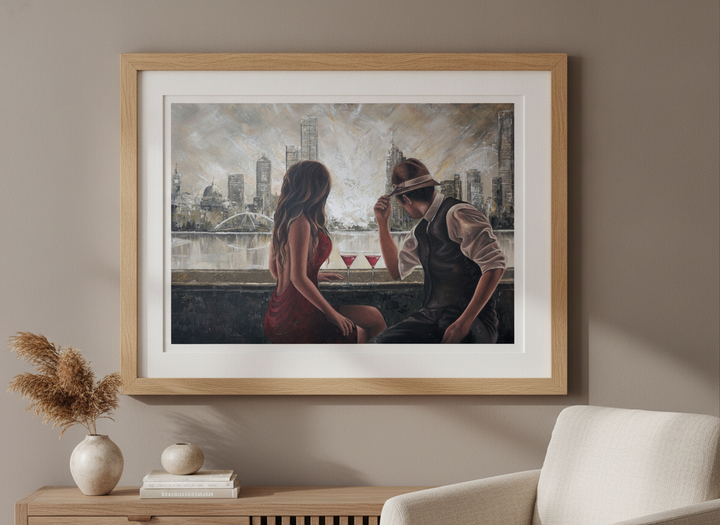 Modern wall art styled above a sofa in a neutral living room