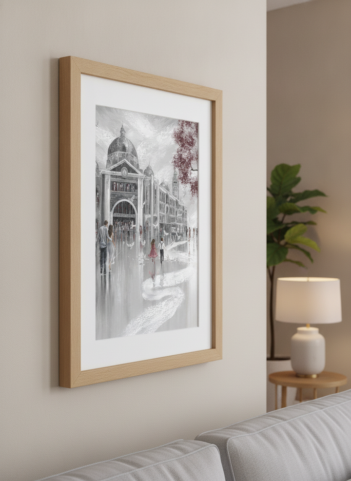Modern wall art styled above a sofa in a neutral living room