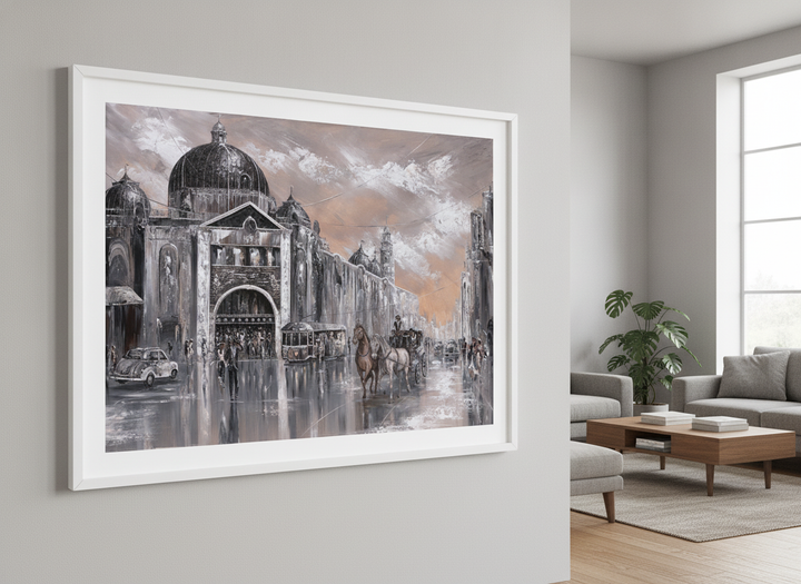 Modern wall art styled above a sofa in a neutral living room