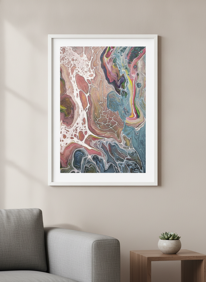 Modern wall art styled above a sofa in a neutral living room