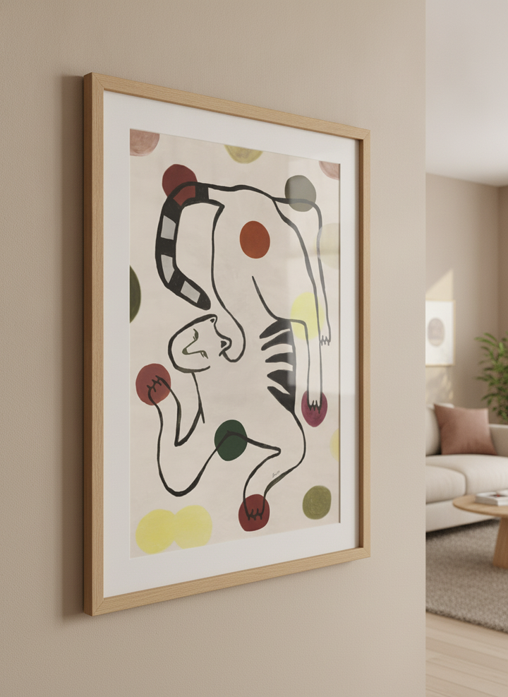 Modern wall art styled above a sofa in a neutral living room