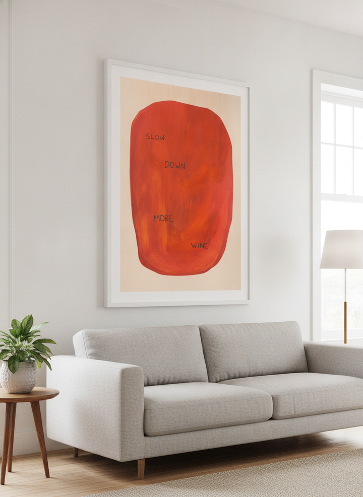 Modern wall art styled above a sofa in a neutral living room