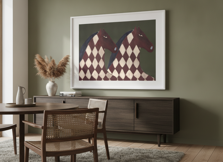 Wall art styled above a dining table in a contemporary home