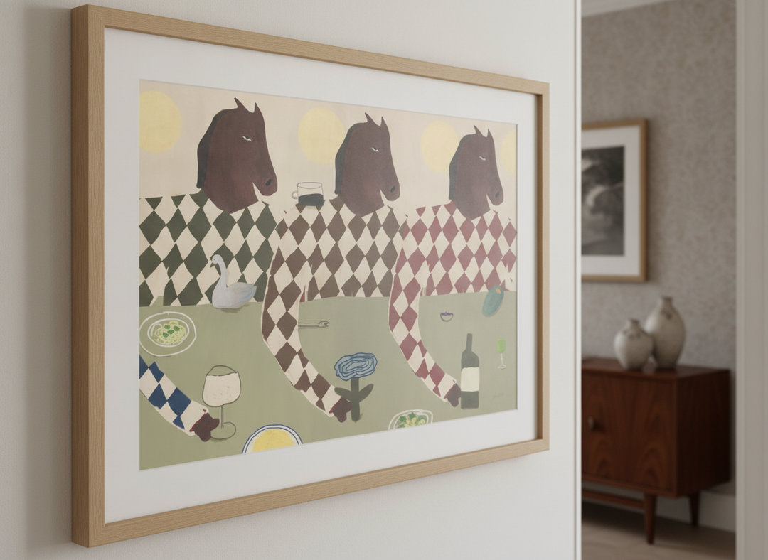 Wall art styled above a dining table in a contemporary home