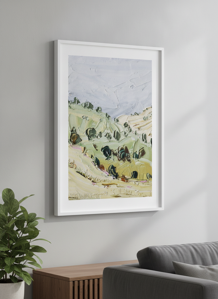 Modern wall art styled above a sofa in a neutral living room