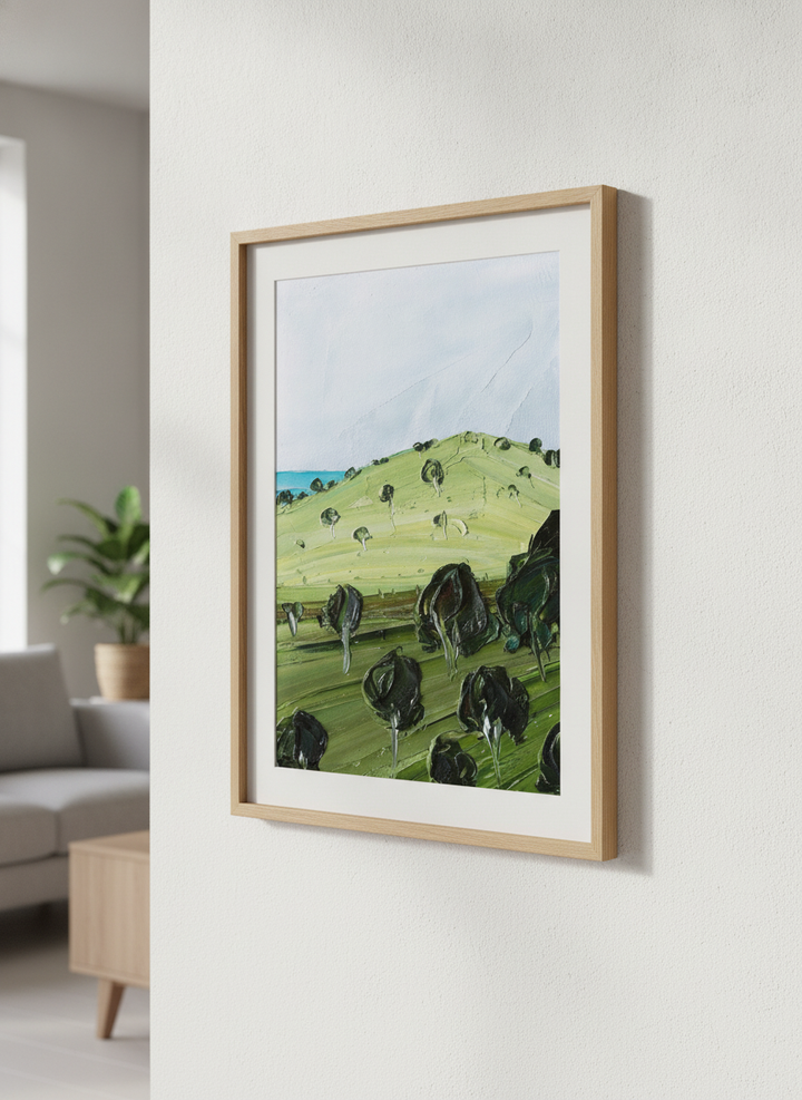 Modern wall art styled above a sofa in a neutral living room