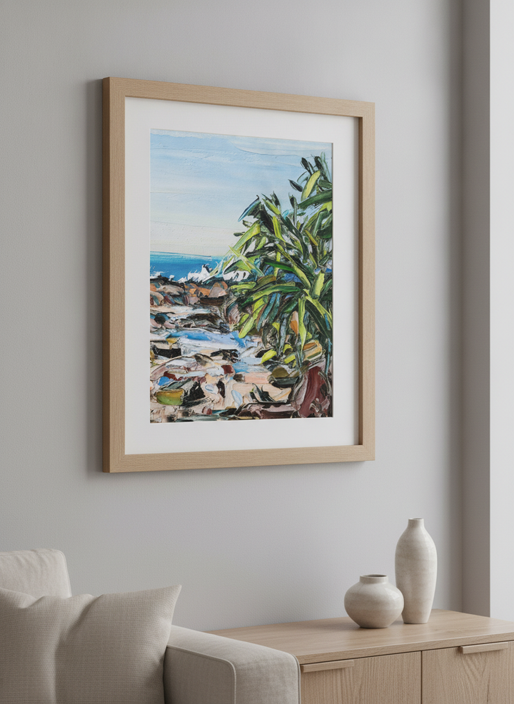 Modern wall art styled above a sofa in a neutral living room